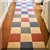 D013. Wool runner rug with checkerboard design. 15'1” x 2'9” - $165